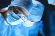 © shefkate - Shot of surgeons working on a patient in an operating room.