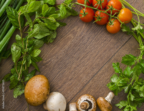 Naklejka na meble various vegetables in a circle on the wooden floor