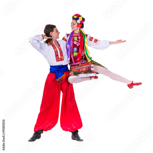 Fotografie, Obraz beautiful dancing couple in ukrainian polish national traditional costume clothe