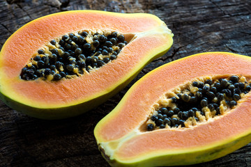 Wall Mural - Papaya on wooden background