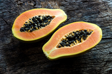 Wall Mural - Papaya on wooden background