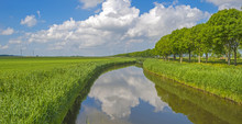 Canal Through A Rural Landscape In Summer

