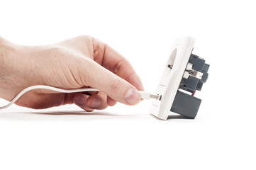 Plug in. A man stabs a usb plug into a usb port