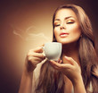 © Subbotina Anna - Beautiful young woman enjoying hot coffee