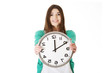 © Piotr Marcinski - Happy woman holding office clock