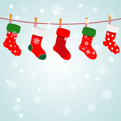 Wall Mural - christmas background with socks hanging on a rope