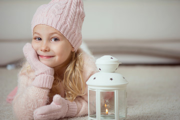 Cute girl in pink celebrating Christmas