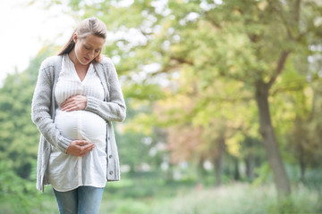 Expecting woman in nature