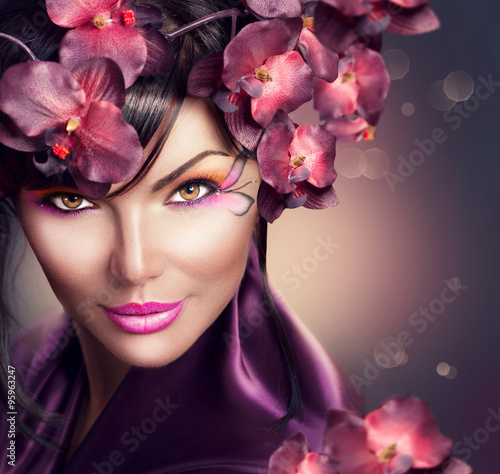 Fototapeta dla dzieci Beautiful woman with orchid flower hairstyle and creative makeup