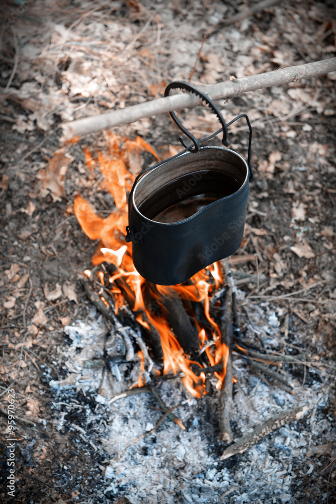 Kettle on fire in the forest