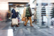 © FotoKachna - Group of people walking in shopping centre,  zoom effect, motion