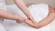 © iLight photo - A qualified therapist doing a pressure point massage