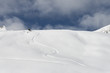 Snowboard trail on virgin snow powder alpine landscape