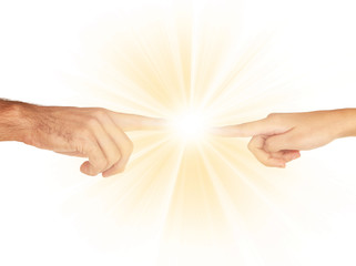 Wall Mural - Women and men hand attracted to each other with light isolated on white