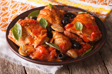 Wall Mural - Homemade Cacciatori chicken on a plate close-up. horizontal
