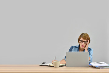 Busy office worker in front of laptop, isolated