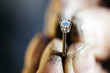 Ring held by jeweler after polishing
