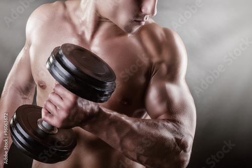 Fototapeta do kuchni Man with dumbbells