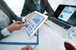 © DragonImages - Discussing business graphs