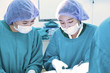 © nimon_t - two veterinarian surgeons in operating room take with art lighting and blue filter