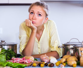 Wall Mural - Frustrated girl looking at ingredients