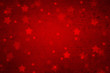 Grunge magical blurry star shape abstract Christmas and New Year Holidays copy space on red background. Lovely red colored textured Xmas greeting card illustration background.
