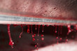 © Mint Images - Fresh grape juice dripping from roller at grape press