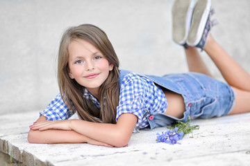 portrait of little girl outdoors in summer