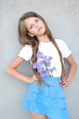 Wall Mural - portrait of little girl outdoors in summer