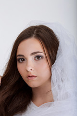 Close up portrait of beautiful young woman face. Isolated on whi