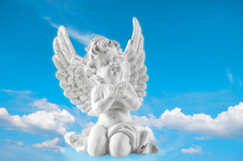 Guardian Engel On Blue Sky Background. Religion And Faith