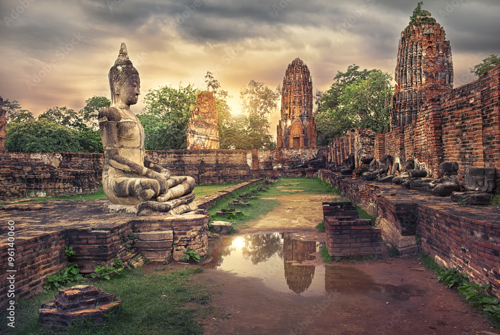 ancient Buddha statue and old Wat Mahathat pagoda in history temple of  Ayutthaya Historical Park,world heritage sites of unesco.Vintage effect add for create atmosphere - obrazy, fototapety, plakaty 