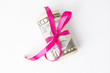 Money with red ribbon on a white background