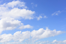 Beautiful Blue Sky And Puffy White Cloud Background