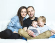 © Louis-Photo - Young happy family with two children at home
