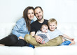 © Louis-Photo - Young happy family with two children at home