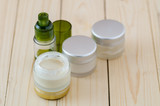 Fototapeta  - Cream container and cosmetics bottle
