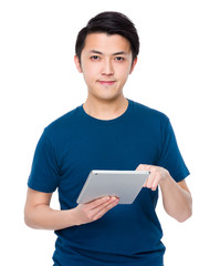 Wall Mural - Asian man use of the tablet pc