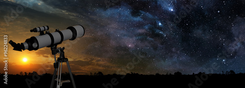 Cuadros en Lienzo milky way at sunset and telescope in the foreground