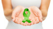 © Syda Productions - hands holding green awareness ribbon