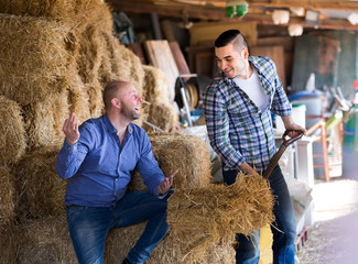 Wall Mural - Farmers talking at ranch