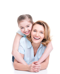 portrait of smiling mother and young daughter