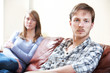 © highwaystarz - Couple With Relationship Difficulties Sitting On Sofa