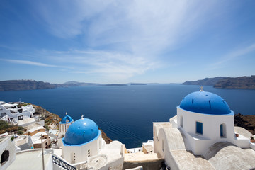 Blue domed churches on the Caldera at Oia on the Greek Island of