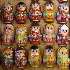 Wall Mural - Colorful russian wooden dolls as fridge magnet