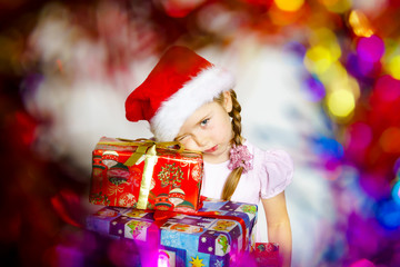 Pretty little girl dressed in santa red hat, new year portrait w