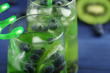 Canvas Print - Kiwi and Blueberry cocktails on color wooden background