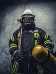 Rescue firefighter in safe helmet and uniform.