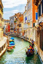 Tourists Traveling In Gondola, Rio Marin Canal, Venice, Italy