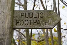 Close Up Of A Public Footpath Sign Made Of Wood
